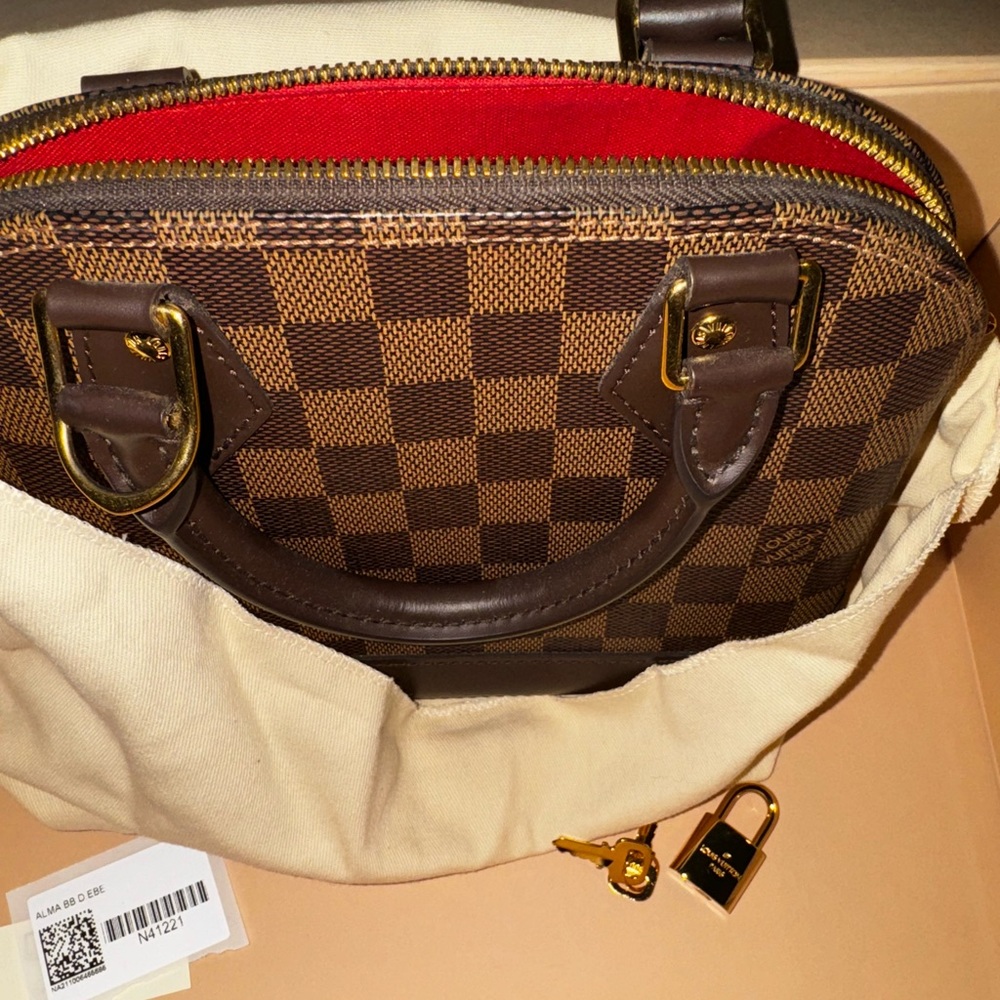 Helping my sister sell her LV purse.
